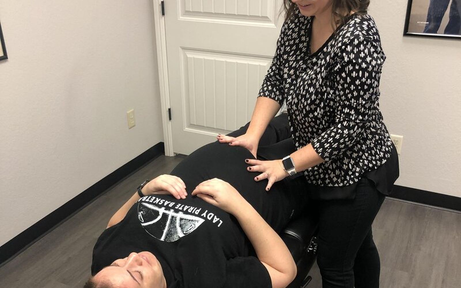Dr. Jill Young adjusting a practice member at Connected Chiropractic in Granbury, TX